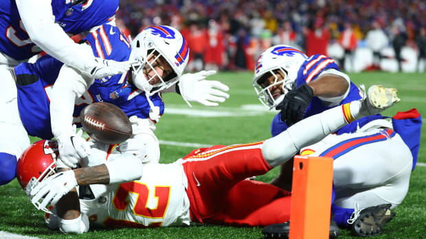Jan 21, 2024; Orchard Park, New York, USA; Buffalo Bills safety Jordan Poyer (21) causes a fumble on Kansas City Chiefs wide receiver Mecole Hardman (12) during the second half for the 2024 AFC divisional round game at Highmark Stadium. Mandatory Credit: Mark J. Rebilas-USA TODAY Sports